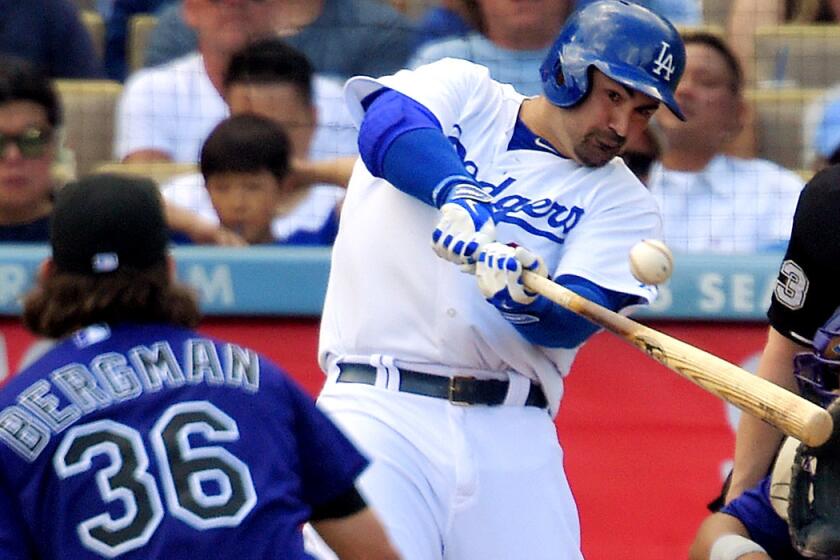 Dodgers first baseman Adrian Gonzalez connects for a three-run home run against Rockies starting pitcher Christian Bergman in the third inning Sunday at Dodger Stadium.