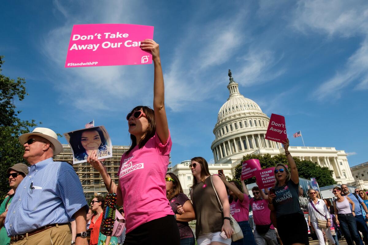 Activists march outside the U.S. Capitol on June 28 to protest the Senate GOP healthcare bill.