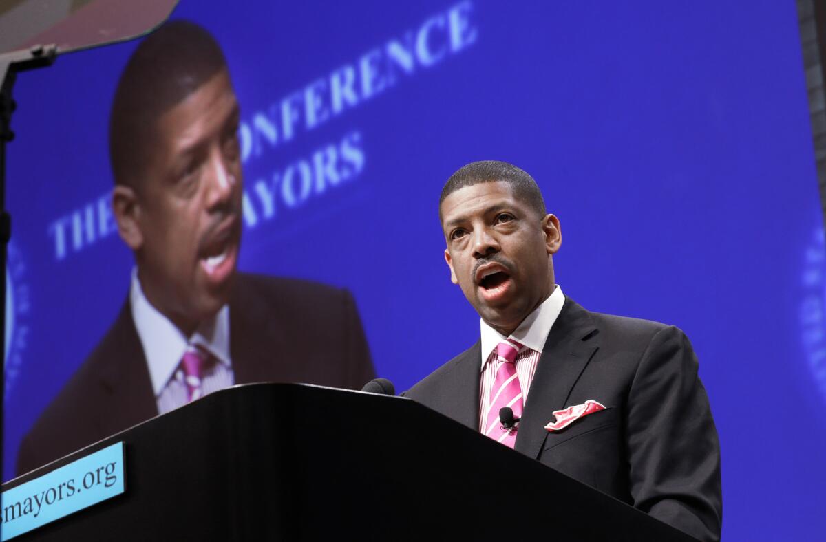 Sacramento Mayor Kevin Johnson, president of the U.S. Conference of Mayors, speaks before a panel discussion about sports and race relations in Dallas in June.