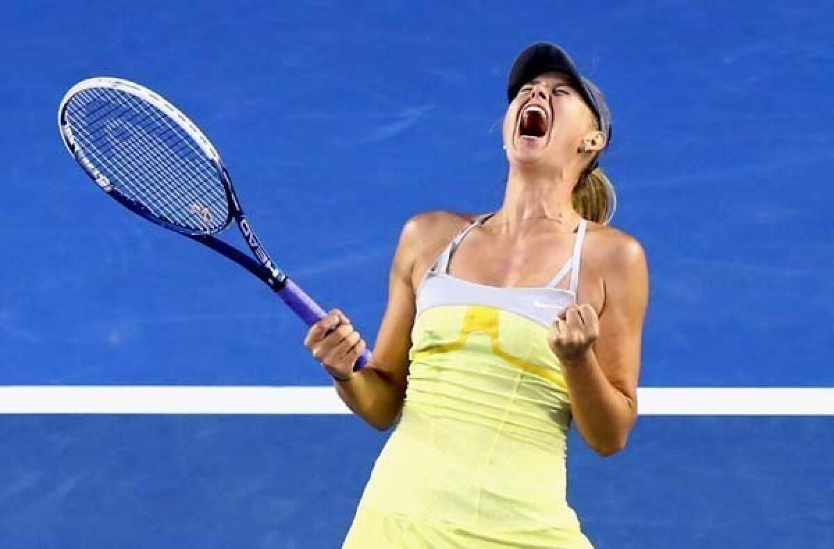 Maria Sharapova reacts after serving an ace to finish off a victory over Venus Williams in the Australian Open on Friday.
