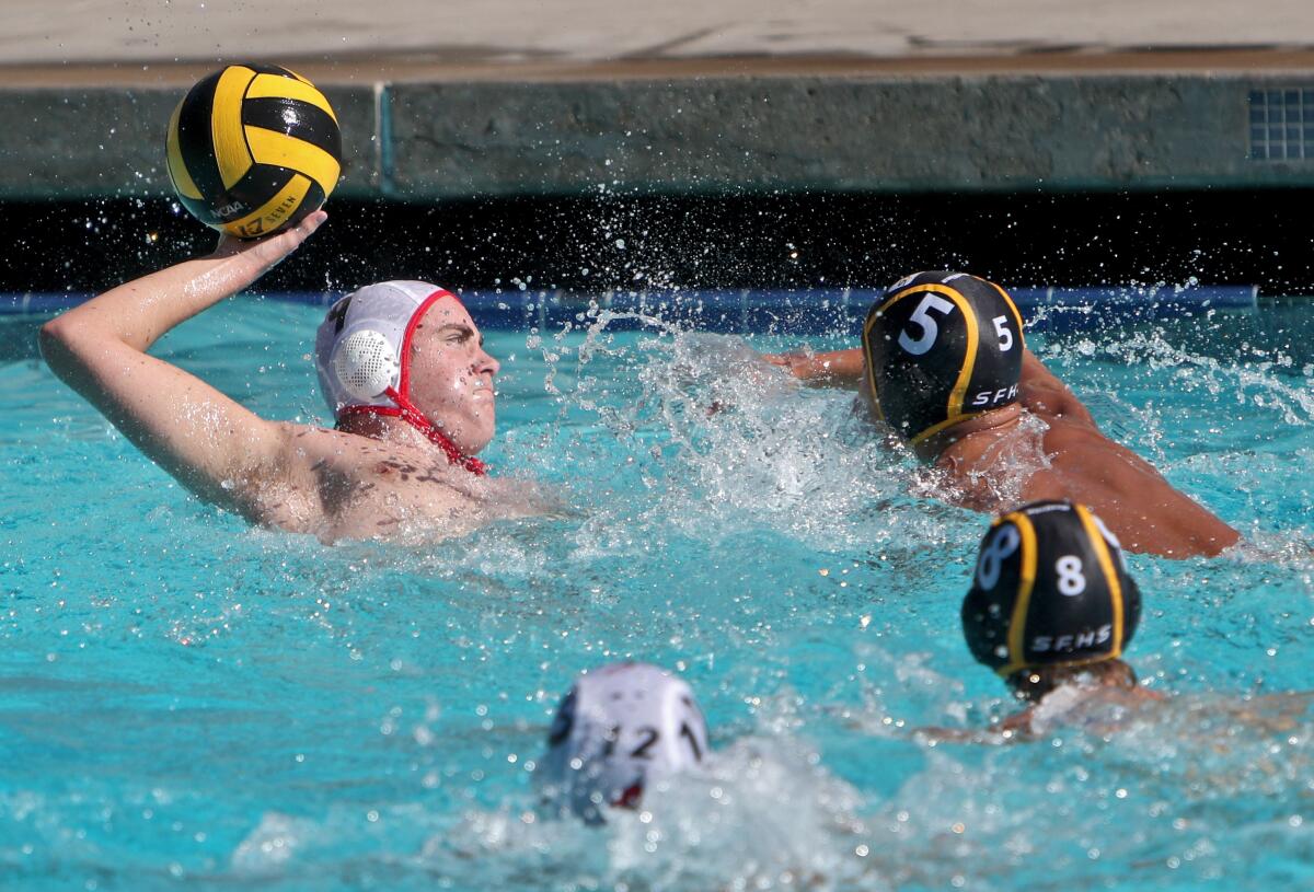 Burroughs High School water polo player Matthew Mucha leans back to take a shot on goal under pressure in CIF Southern Section Division V quarterfinal match vs. St. Francis High School at Notre Dame High School in Sherman Oaks on Saturday, Nov, 9, 2019. St. Francis won the match 9-8.