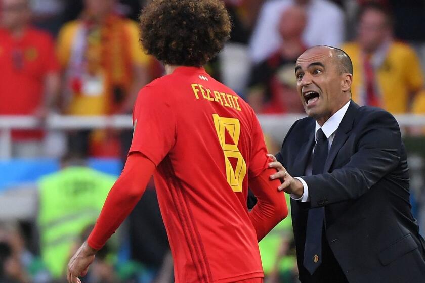 Belgium's coach Roberto Martinez talks to Belgium's midfielder Marouane Fellaini during the Russia 2018 World Cup Group G football match between England and Belgium at the Kaliningrad Stadium in Kaliningrad on June 28, 2018. / AFP PHOTO / Patrick HERTZOG / RESTRICTED TO EDITORIAL USE - NO MOBILE PUSH ALERTS/DOWNLOADSPATRICK HERTZOG/AFP/Getty Images ** OUTS - ELSENT, FPG, CM - OUTS * NM, PH, VA if sourced by CT, LA or MoD **