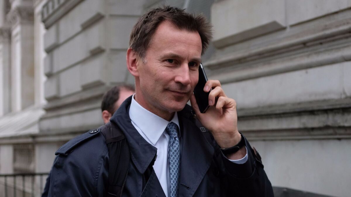 British Health Secretary Jeremy Hunt arrives at Downing Street in central London on Monday.