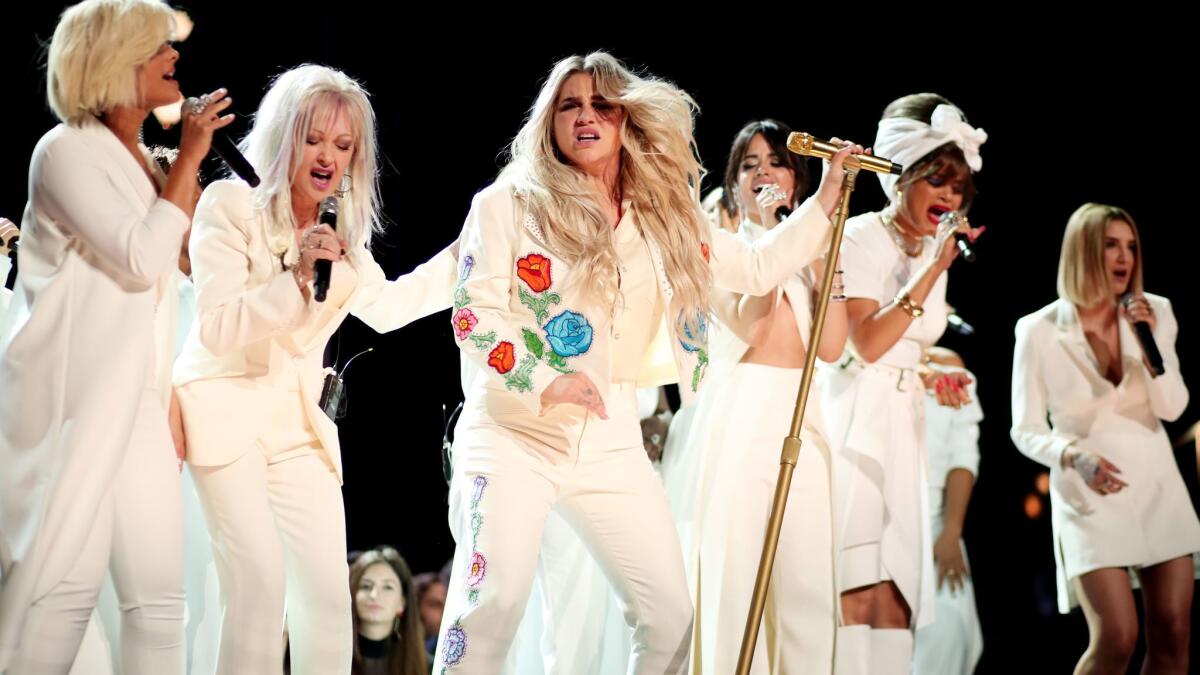 Bebe Rexha, left, Cyndi Lauper, Kesha, Camila Cabello, Andra Day and Julia Michaels perform during the 60th Grammy Awards.