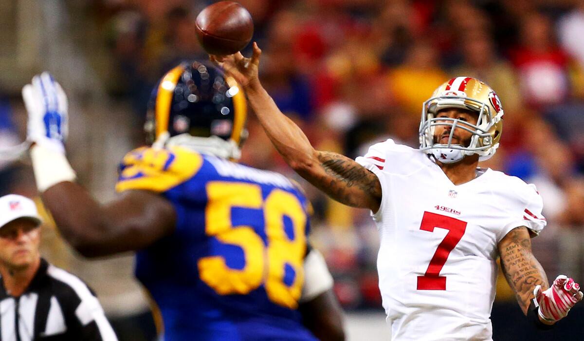 49ers quarterback Colin Kaepernick unloads a pass against the Rams in the second quarter Monday night.