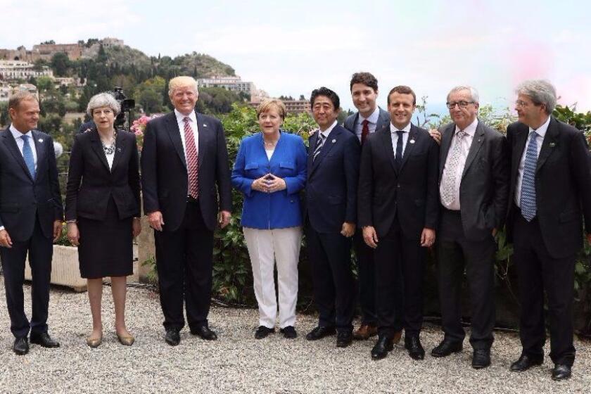 TAORMINA, ITALY - MAY 26: G7 leaders European Council President Donald Tusk, British Prime Minister Theresa May, U.S. President Donald Trump, German Chancellor Angela Merkel, Japanese Prime Minister Shinzo Abe, Canadian Prime Minister Justin Trudeau, French President Emmanuel Macron, European Commission President Jean-Claude Juncker and Italian Prime Minister Paolo Gentiloni pose for a family photo as they attend a flypast at San Domenico Palace Hotel on May 26, 2017 in Taormina , Italy. US President Donald Trump and British Prime Minister Theresa May attend a G7 summit for the first time since their elections. Also new to the table is French President Emmanuel Macron. China have been invited to a meeting during the summit for the first time. (Photo by Dan Kitwood/Getty Images) ** OUTS - ELSENT, FPG, CM - OUTS * NM, PH, VA if sourced by CT, LA or MoD **
