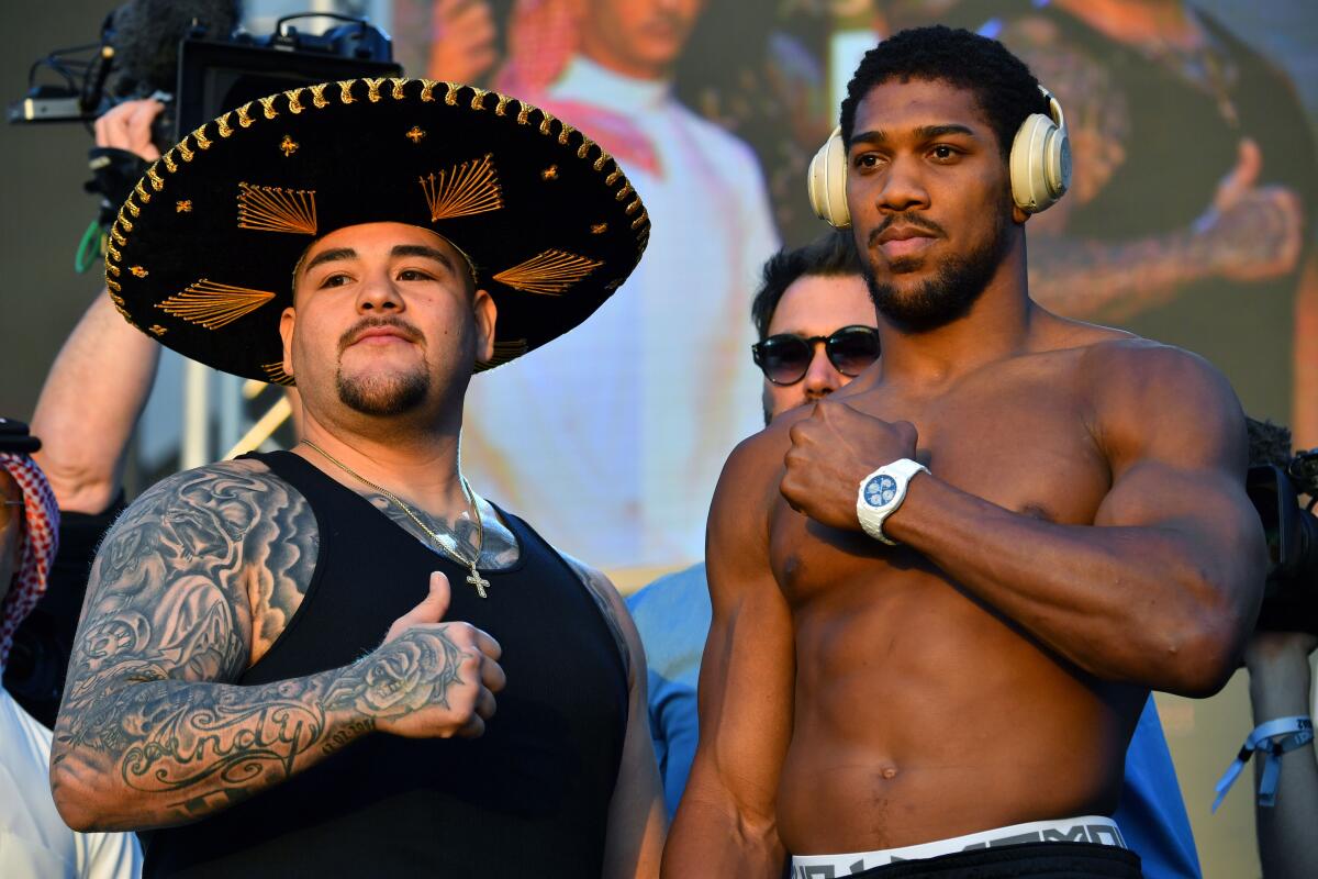 Andy Ruiz Jr., left, and Anthony Joshua pose Friday in Riyadh, Saudi Arabia.