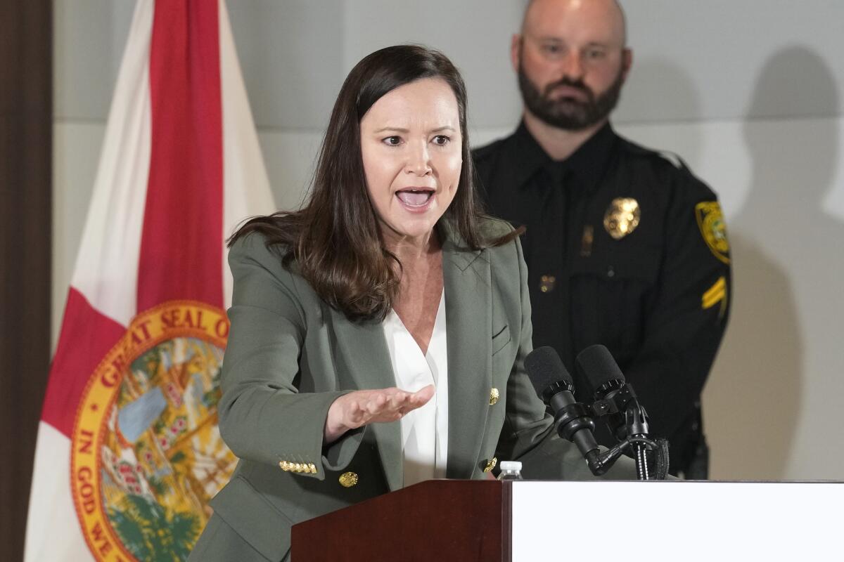 Florida Atty. Gen. Ashley Moody speaks at a news conference.