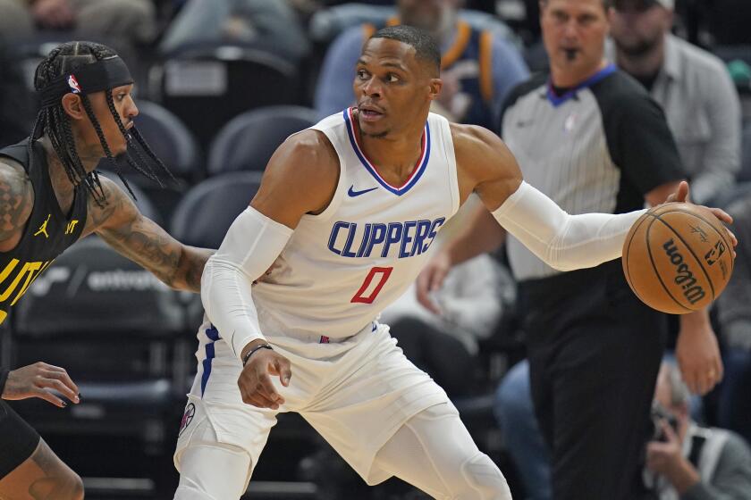 Utah Jazz guard Jordan Clarkson, left, guards against Los Angeles Clippers guard Russell Westbrook.