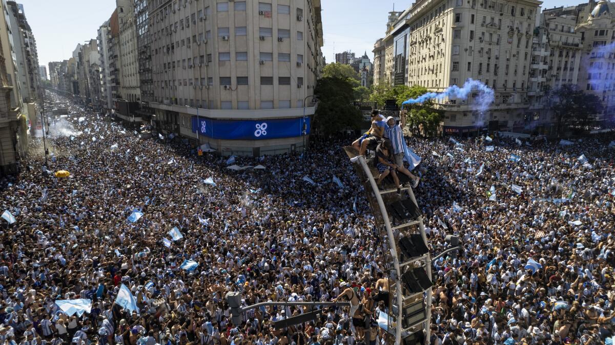 Argentine soccer fans fill Buenos Aires streets to celebrate their team's World Cup victory over France.