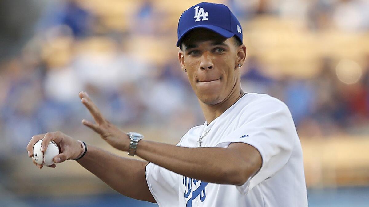 Lonzo Ball, the Lakers' No. 1 pick and No. 2 pick overall in the NBA draft, throws the ceremonial first pitch before the start of a Rockies-Dodgers game at Dodger Stadium June 23.