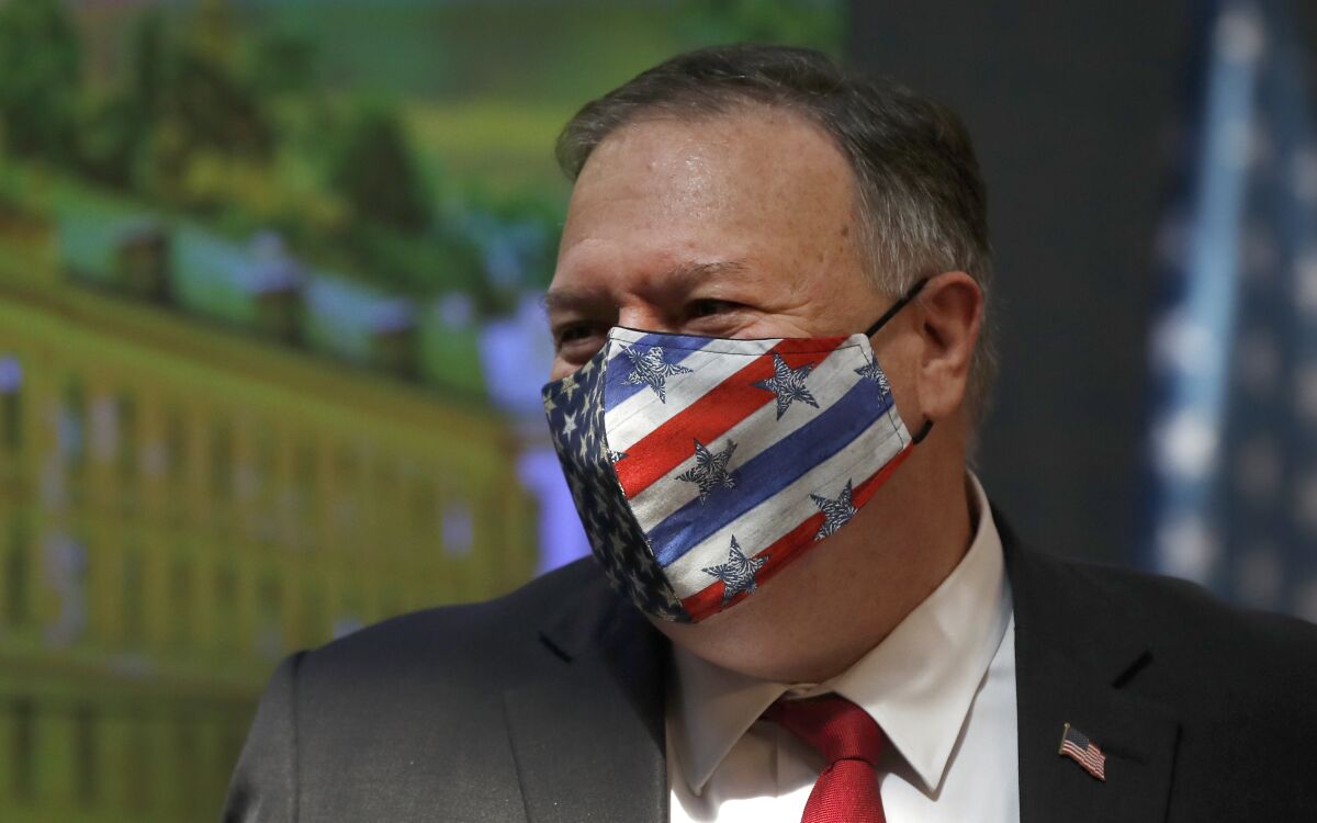U.S. Secretary of State Mike Pompeo wears a face mask during a joint press conference as part of a meeting with the Prime Minister of Czech Republic Andrej Babis in Prague, Czech Republic, Wednesday, Aug. 12, 2020. U.S. Secretary of State Mike Pompeo is in Czech Republic at the start of a four-nation tour of Europe. Slovenia, Austria and Poland are the other stations of the trip. (AP Photo/Petr David Josek, Pool)