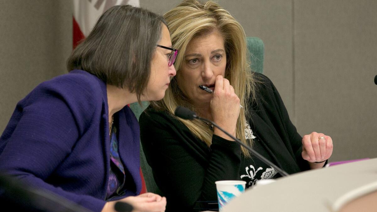Assemblywoman Laura Friedman (D-Glendale), left, confers with Assemblywoman Marie Waldron (R-Escondido), the committee co-chair during their first hearing about sexual harassment.