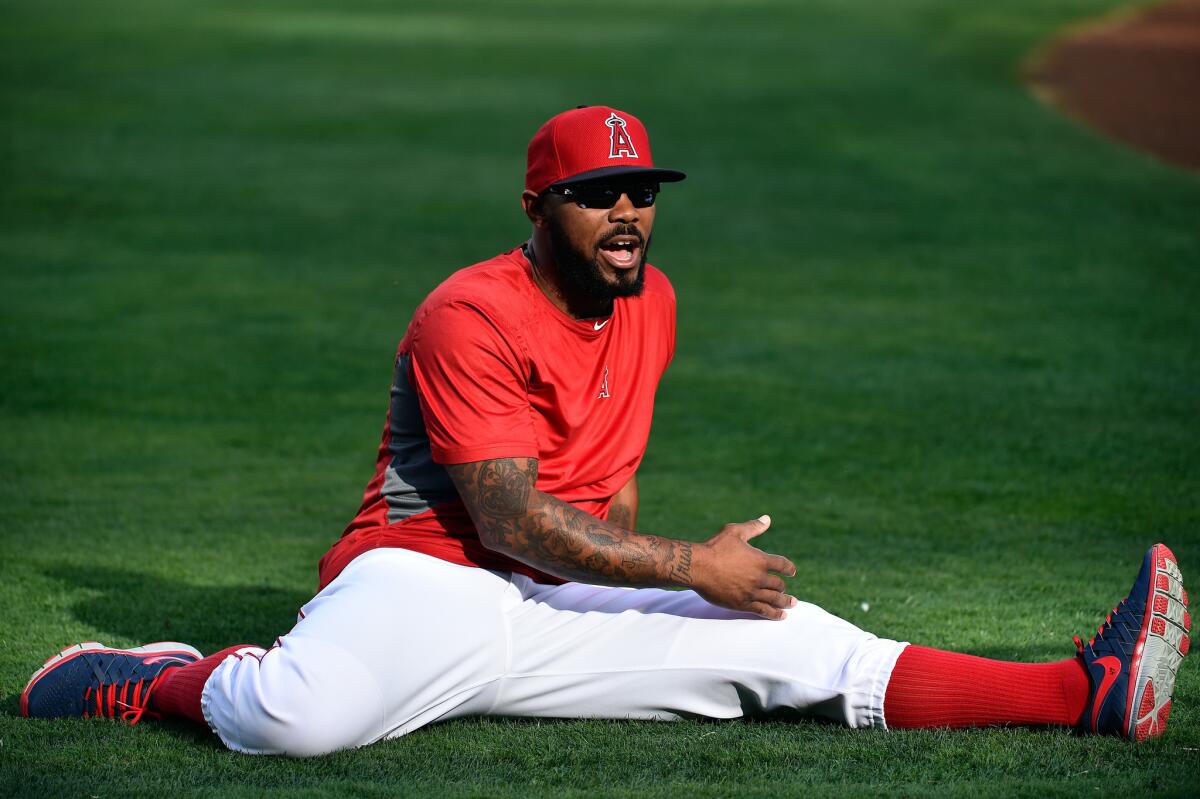 Angels second baseman Howie Kendrick stretches prior to Game 2 of the American League division series Oct. 3 against the Kansas City Royals at Angel Stadium.