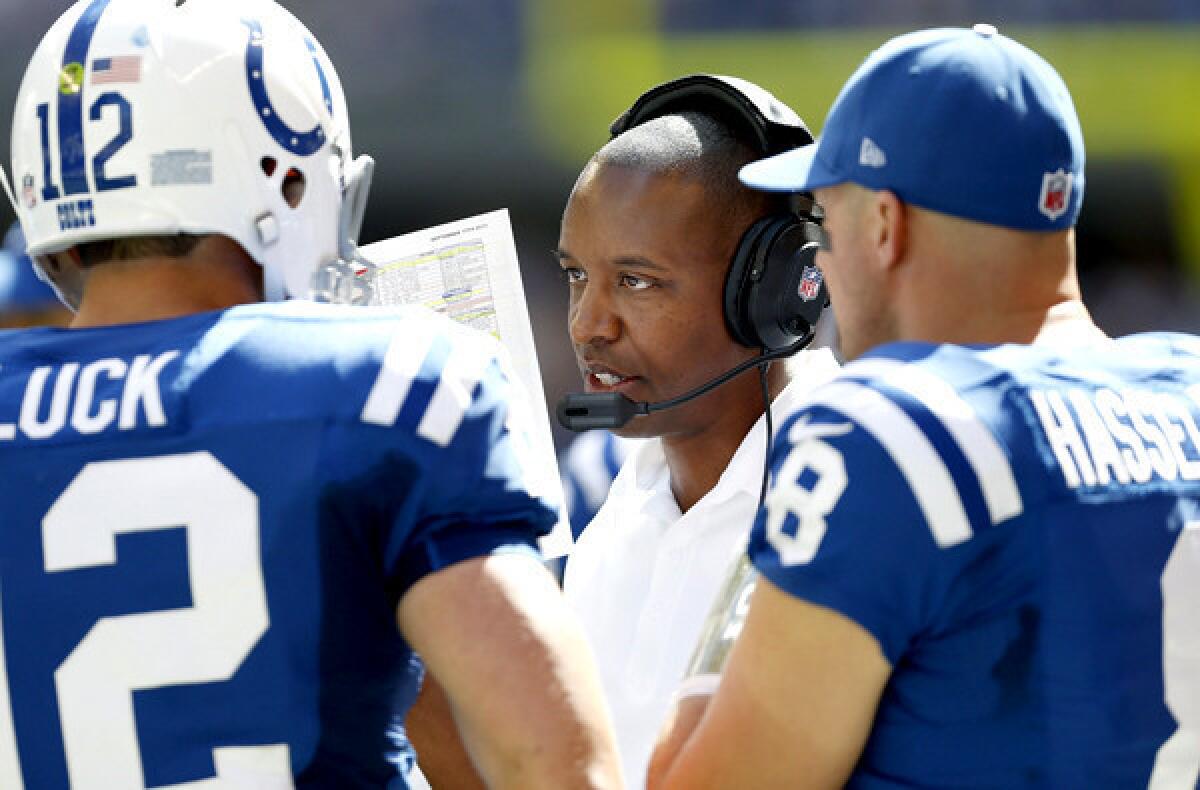 Colts offensive coordinator Pep Hamilton talks with Indianapolis Colts quarterbacks Andrew Luck and Matt Hasselbeck in the second half of a 24-20 victory over the Miami Dolphins last month.