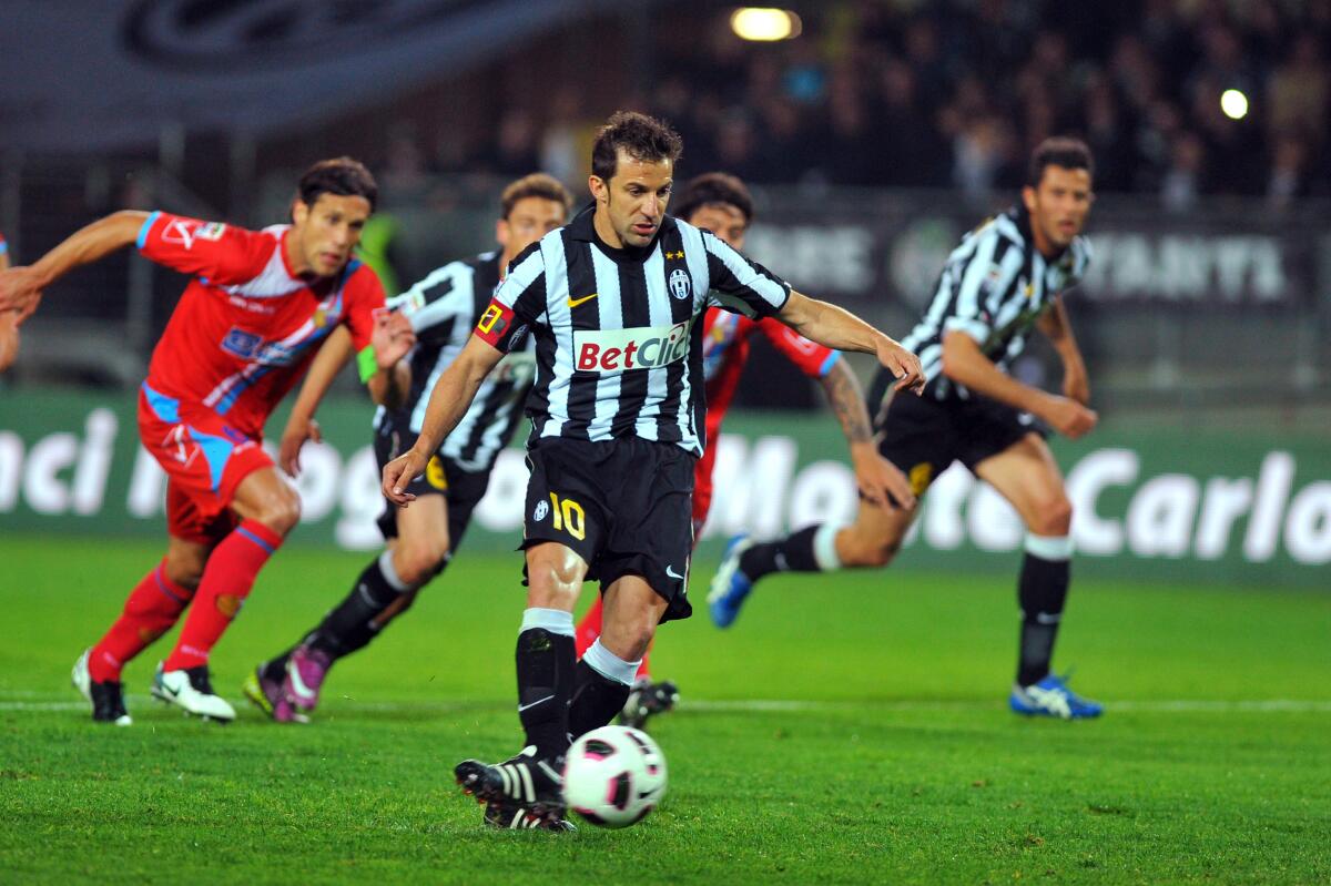 Juventus' Alessandro Del Piero, center, scores during a Serie A soccer match against Catania on April 23, 2011. 
