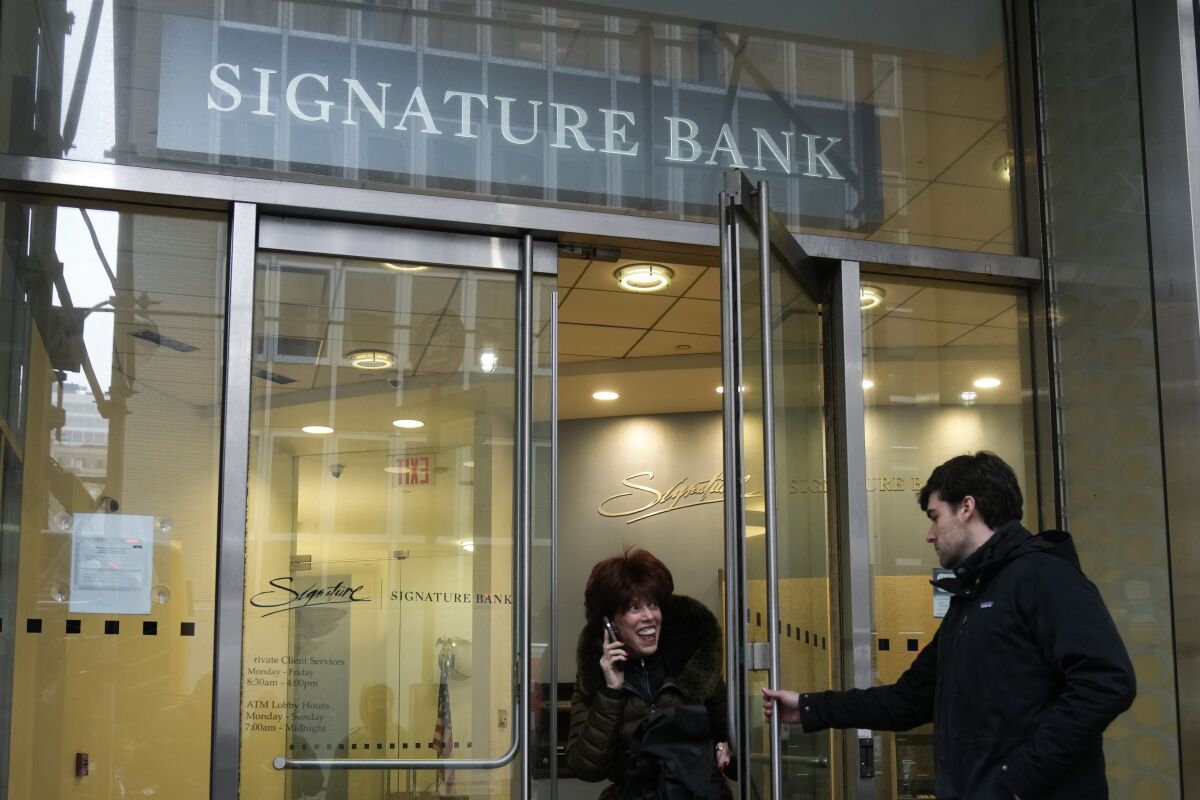 
A woman leaves a branch of Signature Bank in New York last week. 