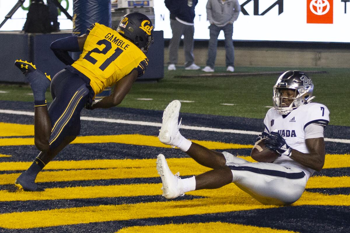 Nevada wide receiver Romeo Doubs (7) makes a touchdown reception behind California cornerback Collin Gamble (21) during the second quarter of an NCAA college football game Saturday, Sept. 4, 2021, in Berkeley, Calif. (AP Photo/D. Ross Cameron)