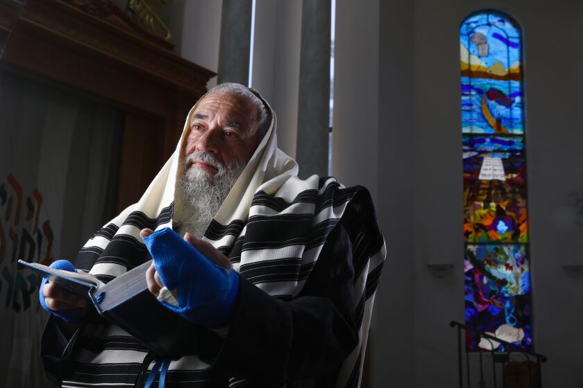 Rabbi Yisroel Goldstein in the sanctuary at Chabad of Poway, June 13, 2019 in Poway, California. He was shot in the hands when a gunman opened fire at the synagogue with an assault style rifle on April 27, on last day of the Passover holiday, during Sabbath services. Lori Gilbert Kaye, a member of the synagogue, was was killed during the attack, and others were also injured.
