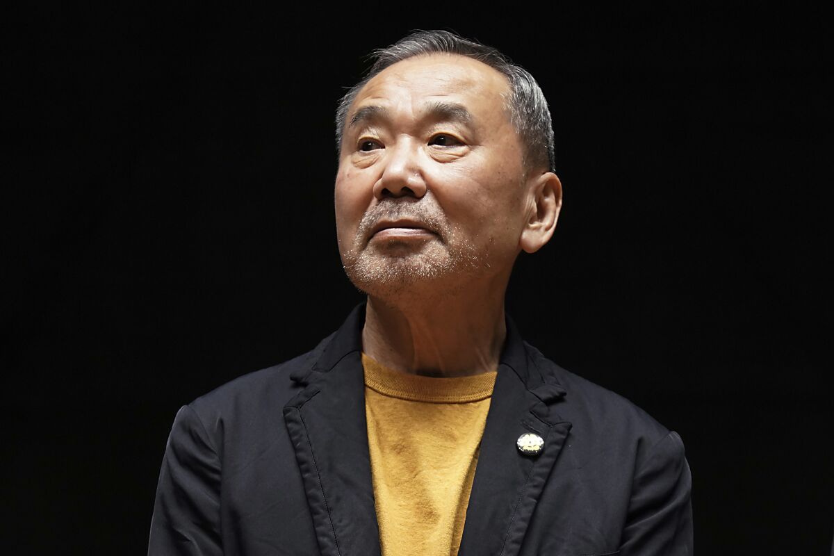 FILE - Japanese novelist Haruki Murakami poses for media during a press conference on the university's new international house of literature as known as The Haruki Murakami Library at the Waseda University Wednesday, Sept. 22, 2021, in Tokyo. (AP Photo/Eugene Hoshiko, File)