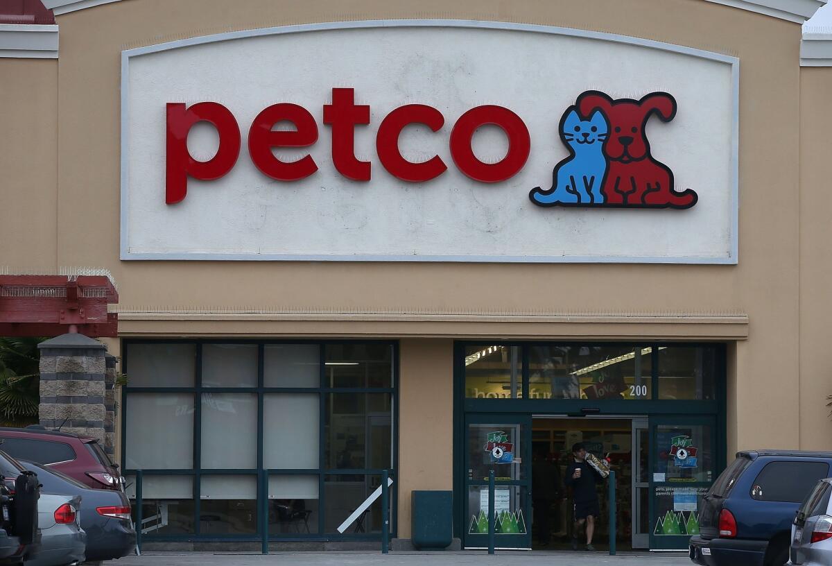 A customer leaves a Petco store in San Francisco on Nov. 23.