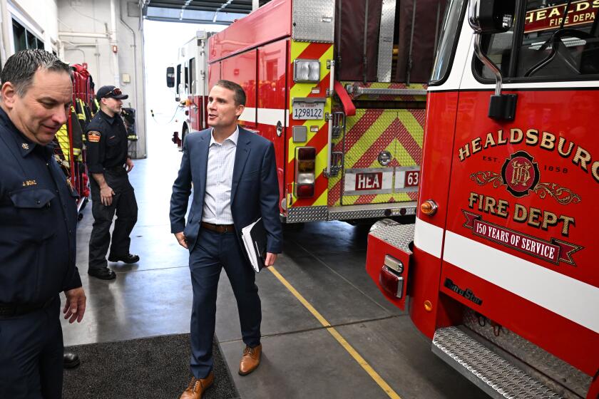 HEALDSBURG CA JANUARY 26, 2024 - Recently named leader of the California Senate Mike McGuire speaks with firefighters while visiting the Healdsburg fire station in Healdsburg, California on Friday, January 26, 2024. (Josh Edelson / For The Times)