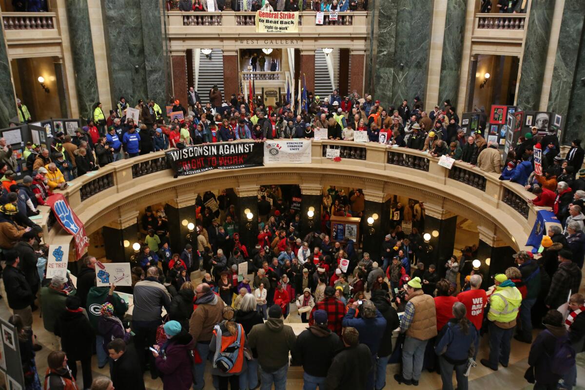 Protesters inside the Wisconsin State Capitol Wednesday lobbying against the right-to-work bill working its way through the Republican-led legislature.