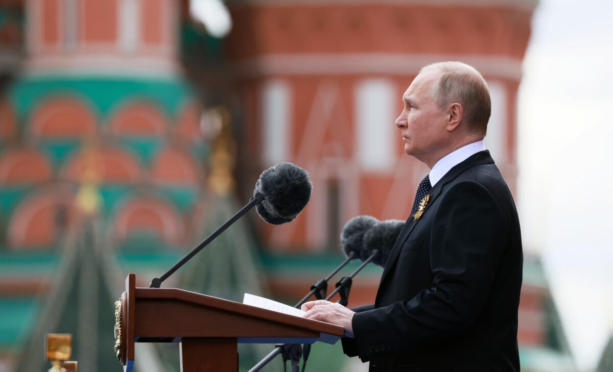 Russian President Vladimir Putin speaking from lectern