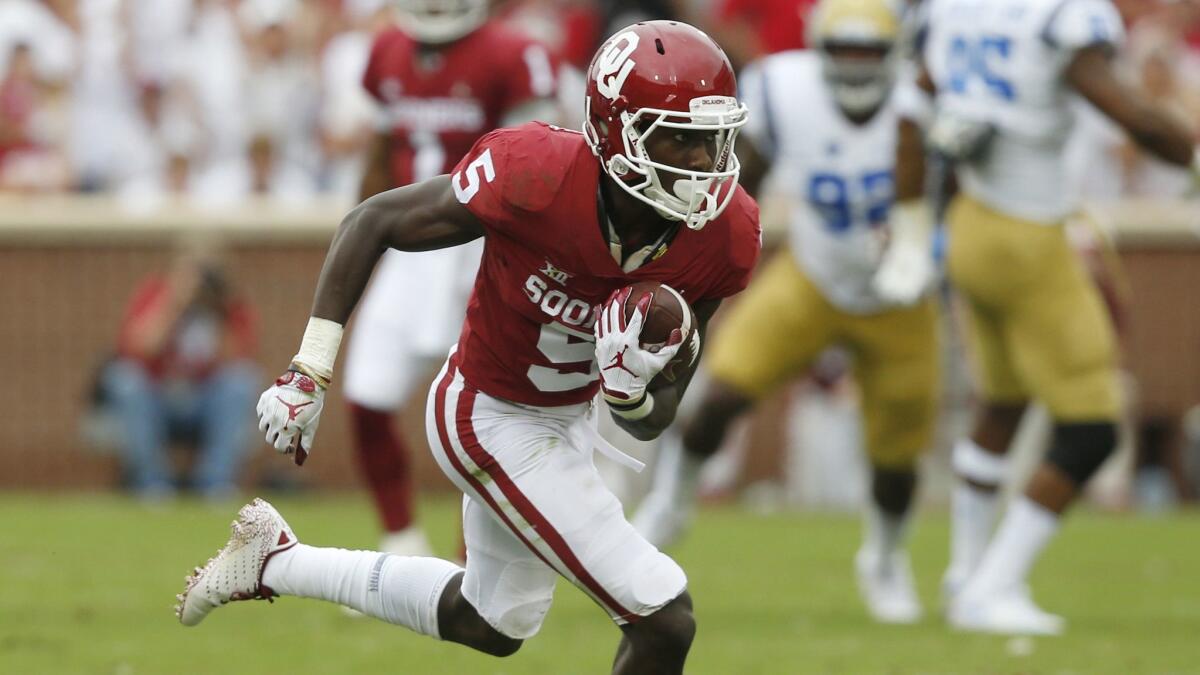 Oklahoma wide receiver Marquise Brown carries the ball during a game against UCLA in October.