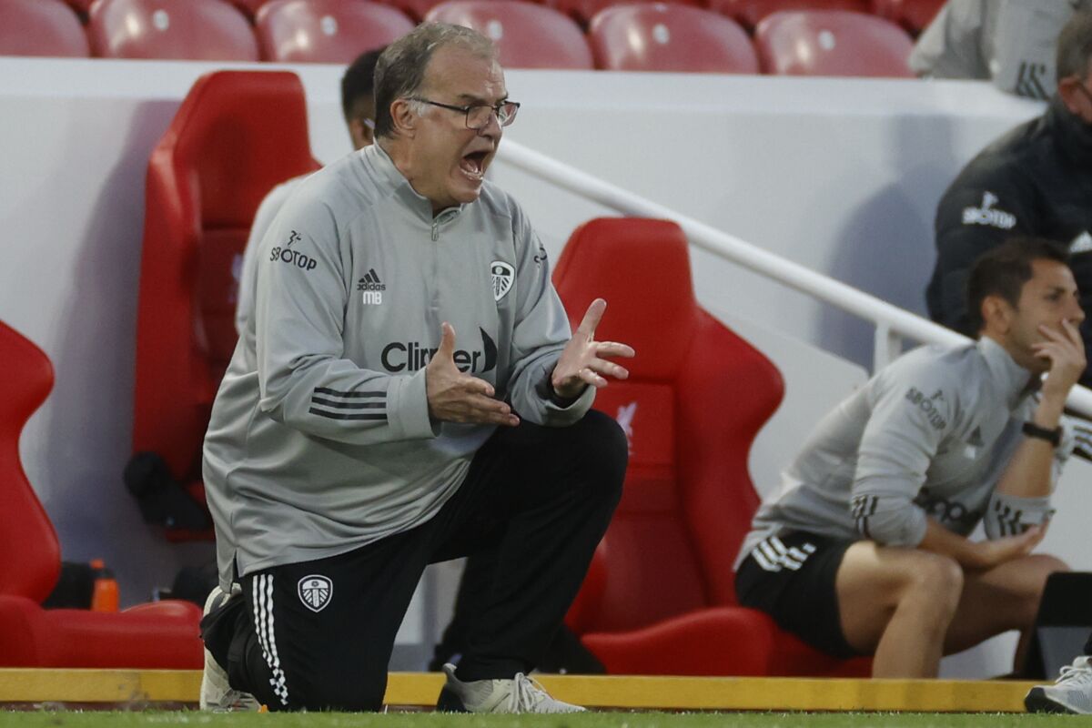 Leeds United's head coach Marcelo Bielsa calls out to his players during the English Premier League soccer match between Liverpool and Leeds United, at the Anfield stadium, in Liverpool, Saturday, Sept. 12, 2020. (Phil Noble, Pool via AP)