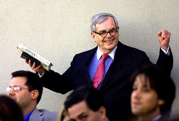 Dominick Dunne gestures during an introduction before reading to a small group of people from his book "Justice: Crimes, Trials and Punishments" at a Beverly Hills hotel.