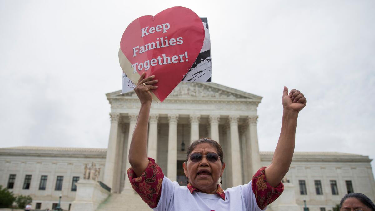 Antonio Surco of Silver Spring, Md., participates in a demonstration outside the U.S. Supreme Court on Thursday.