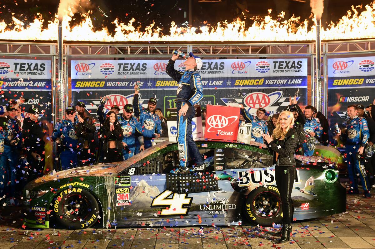 Kevin Harvick celebrates in victory lane after winning Sunday's NASCAR Cup race at Texas Motor Speedway.