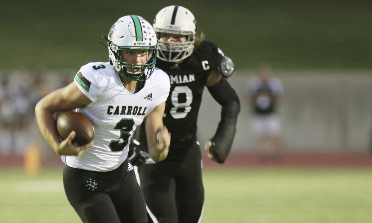 FILE - Southlake Carroll quarterback Quinn Ewers (3) runs for a first down against Permian during the first half of a high school football game in Odessa, Texas, in this Friday night Sept. 13, 2019, file photo. Quinn Ewers, considered the top quarterback prospect in the class of 2022, said he is skipping his senior year of high school in Texas and plans to enroll at Ohio State for the upcoming semester. (Ben Powell/Odessa American via AP, File)