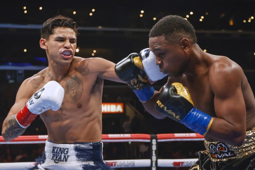 Ryan Garcia, left, hits Javier Fortuna during a lightweight boxing bout Saturday, July 16, 2022.