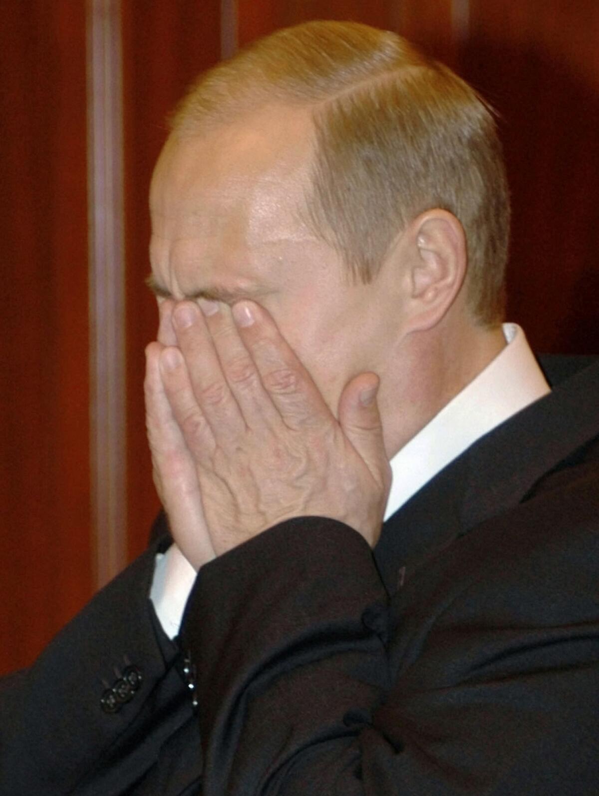Russian President Vladimir Putin reacts to the news that scores of hostages had died as special forces stormed a Moscow theater and freed hundreds of others held by Chechen rebels.