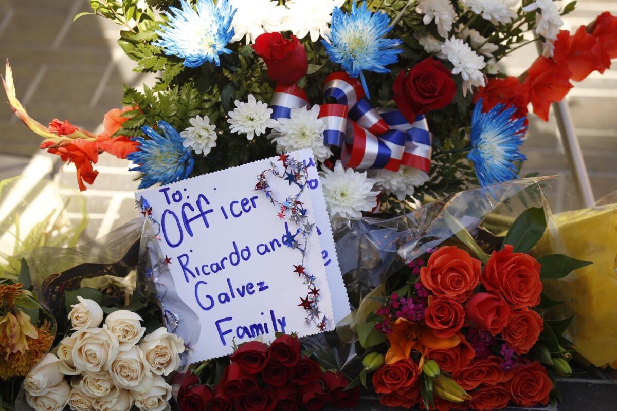 A makeshift memorial for slain Downey Police Officer Ricardo Galvez was set up outside the police station after his death in November.