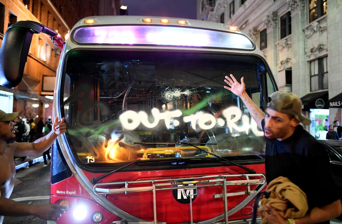 A Metro bus is vandalized in downtown Los Angeles