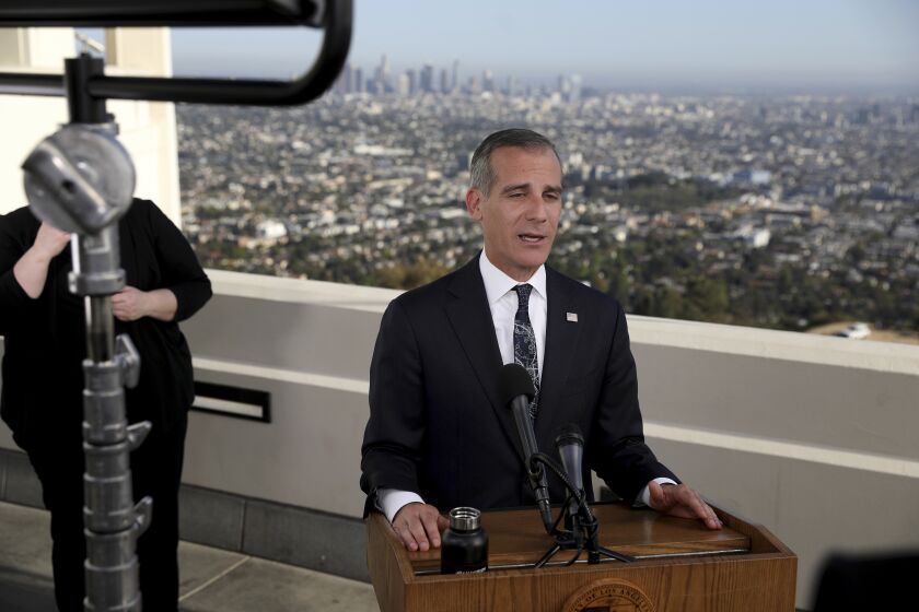 Los Angeles Mayor Eric Garcetti delivers his annual State of the City address from the Griffith Observatory, Monday, April 19, 2021, in Los Angeles. (Gary Coronado/Los Angeles Times via AP, Pool)