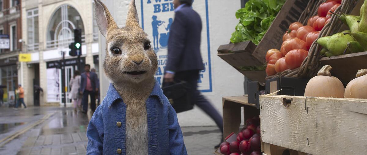 A computer-generated rabbit beside a vegetable stand 