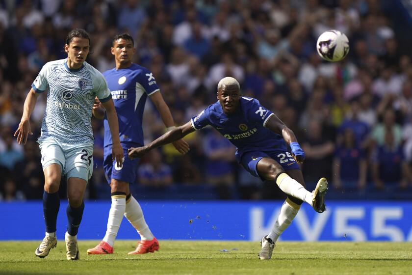 Chelsea's Moises Caicedo scores their side's first goal of the game from the half-way line during the Premier League match between Chelsea FC and AFC Bournemouth at Stamford Bridge, London, Sunday May 19, 2024. (Bradley Collyer/PA via AP)