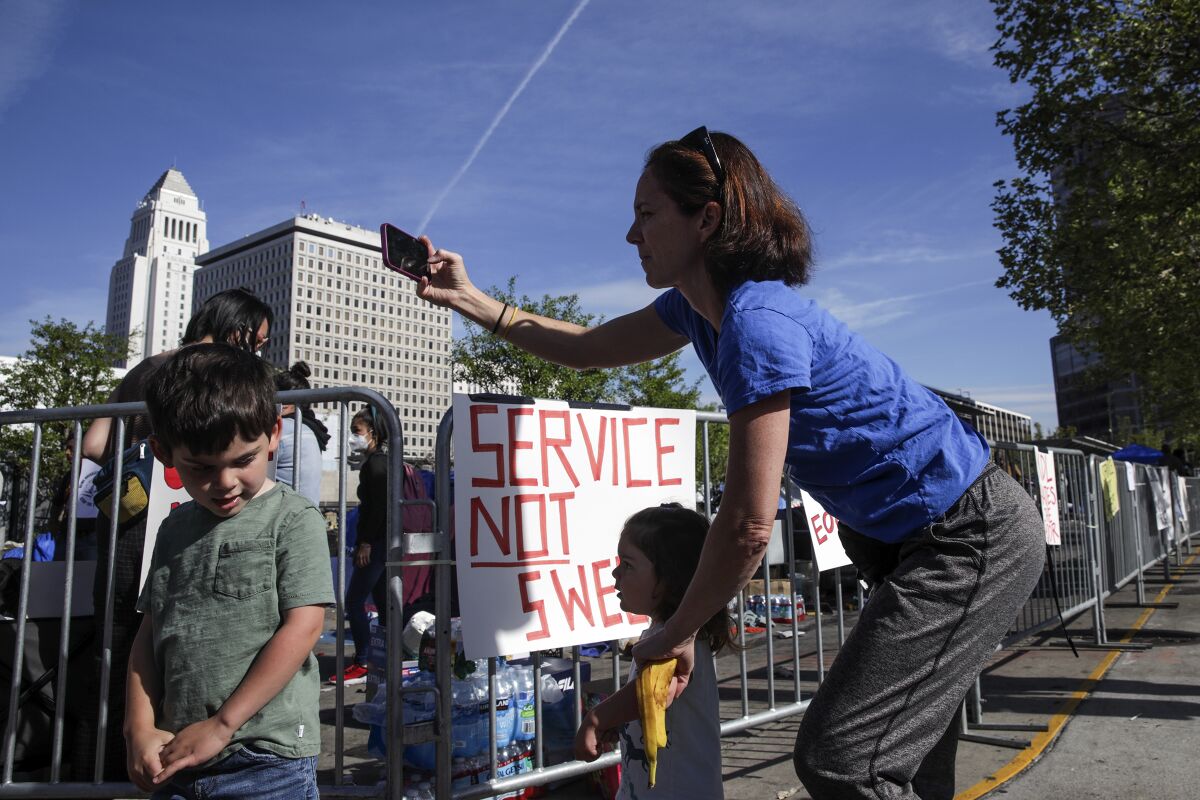 Bitta Sharma brought her two small children to see a homeless encampment.