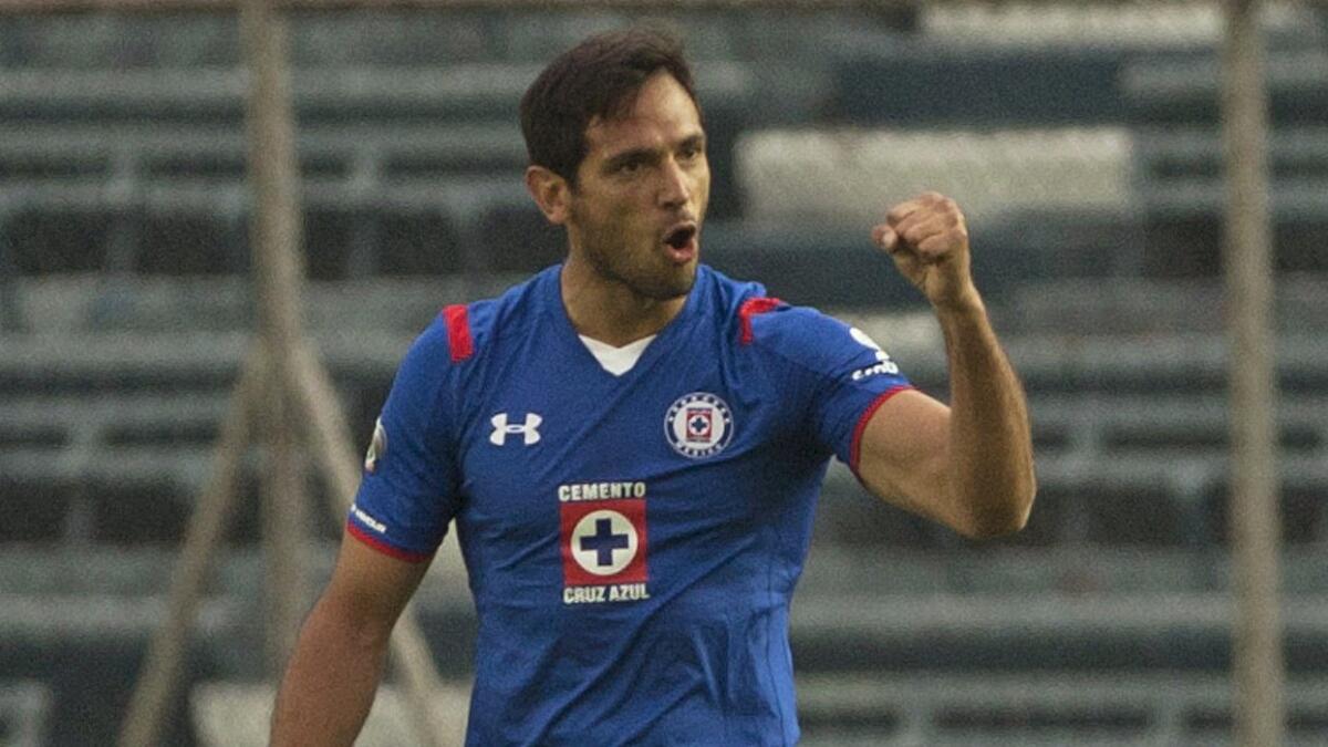 Cruz Azul's Roque Santa Cruz celebrates after scoring against the Tigres in a Mexican soccer league match in Mexico City on April 11.
