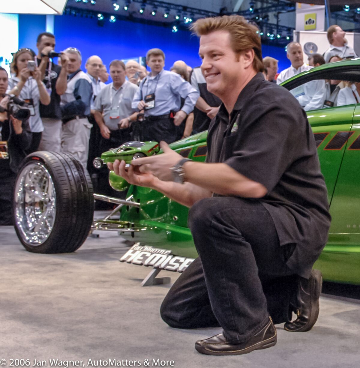 Chip Foose proudly holds a scale model of Hemisfear at SEMA Show 2006