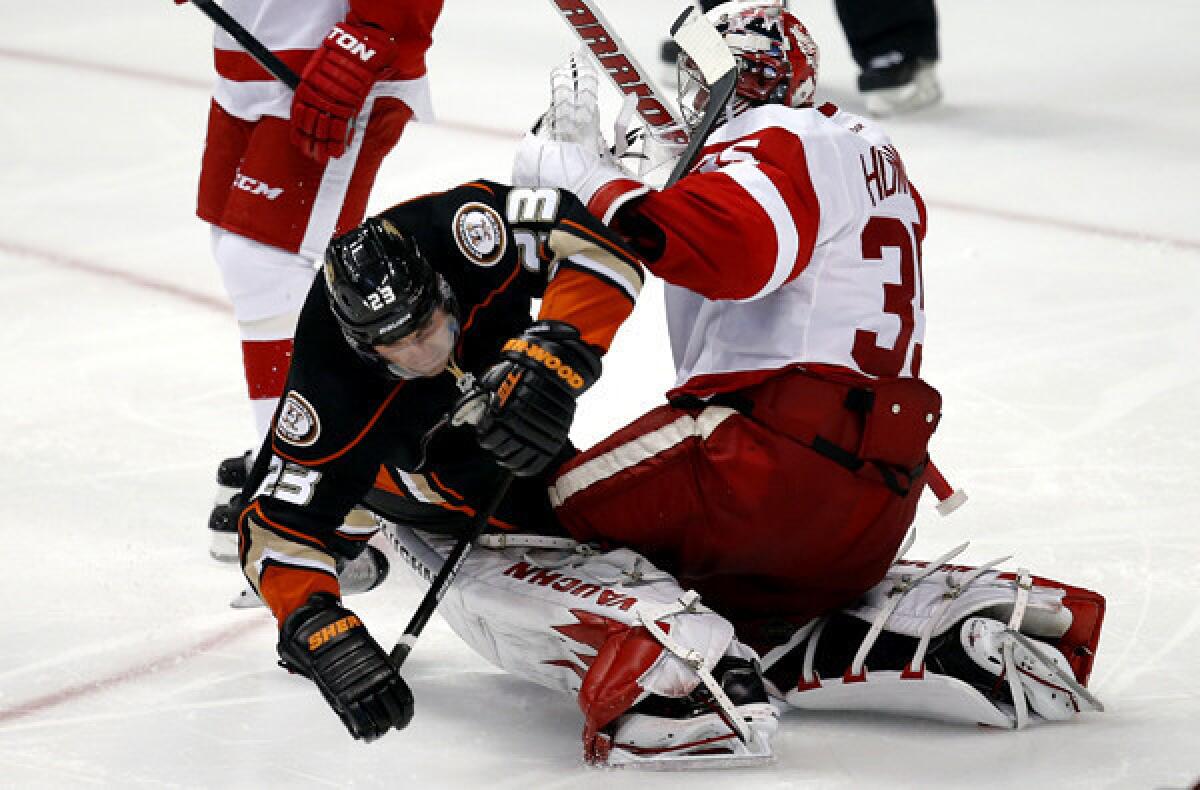 Ducks defenseman Francois Beauchemin collides with Red Wings goalie Jimmy Howard during the third period of a game earlier this season at the Honda Center.