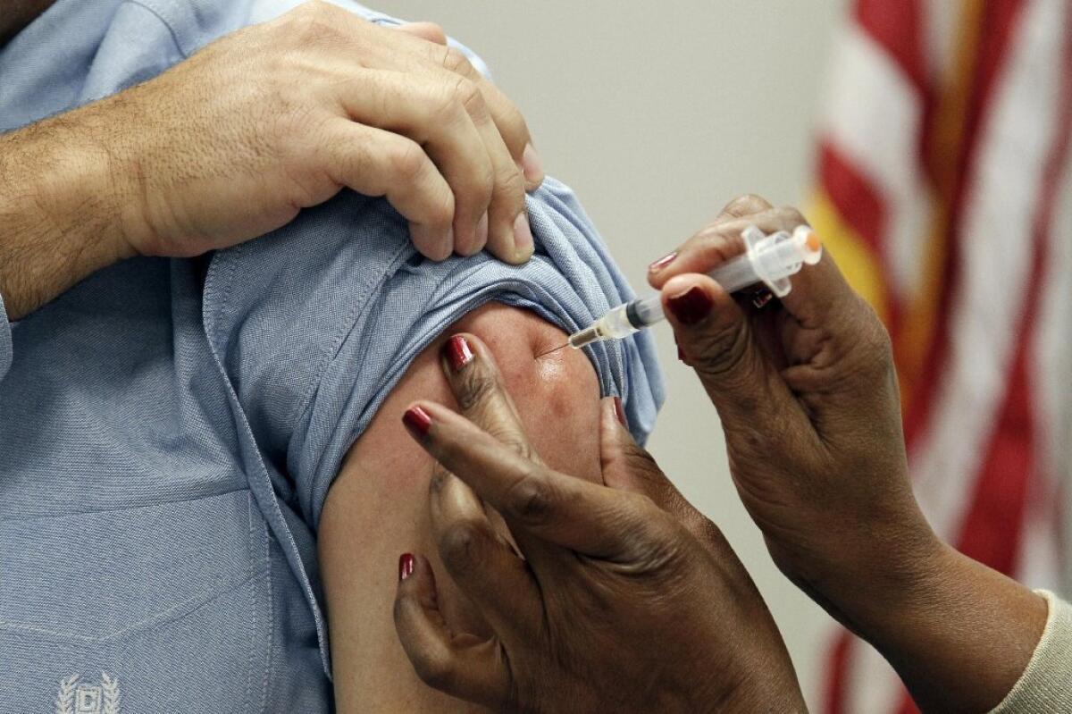 A patient in Jackson, Miss., gets a flu shot. When it comes to childhood diseases such as measles, mumps and whooping cough, some parents are refusing to have their children vaccinated, and those diseases are making something of a comeback.