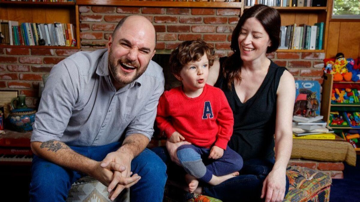 Jordan Horowitz and Julia Hart with their son, Arthur.