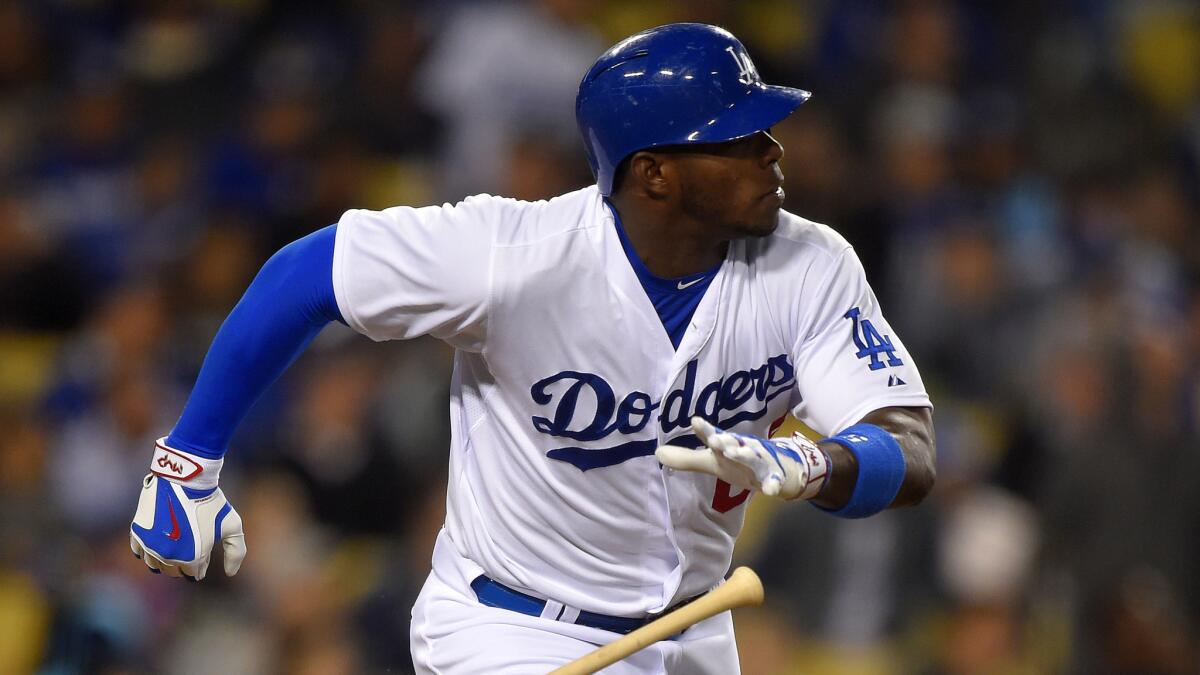 Dodgers right fielder Yasiel Puig hits a double during a game against the San Diego Padres on April 7, 2015.