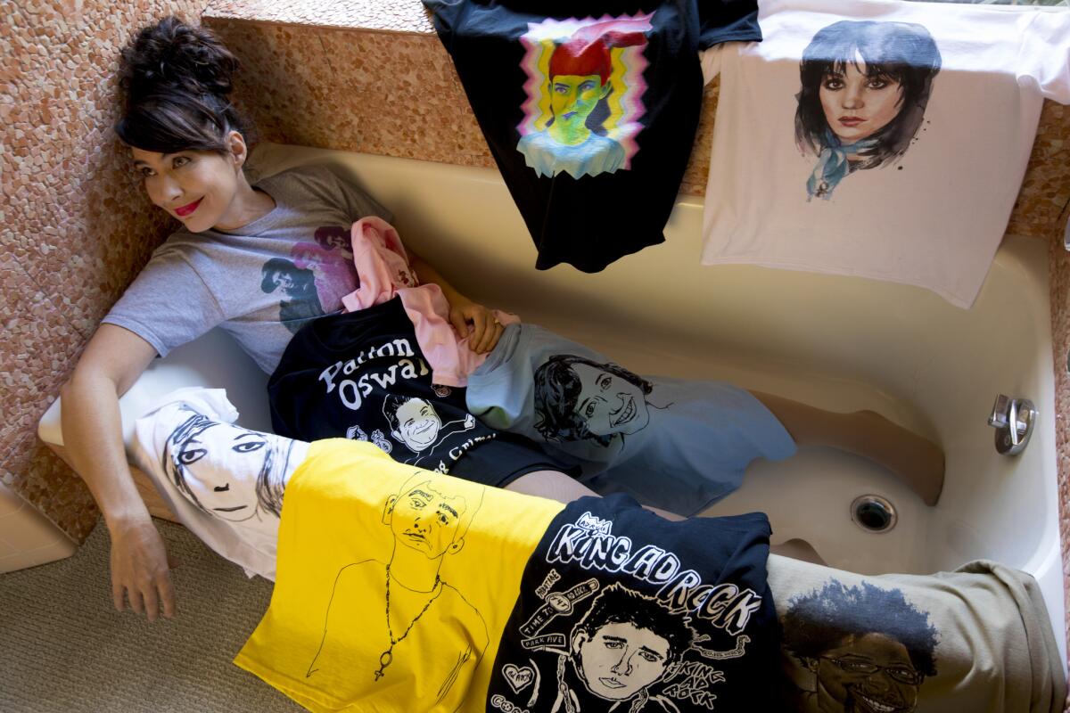 Kathleen Hanna in her Pasadena home with her charitable T-shirt line Tees 4 Togo.
