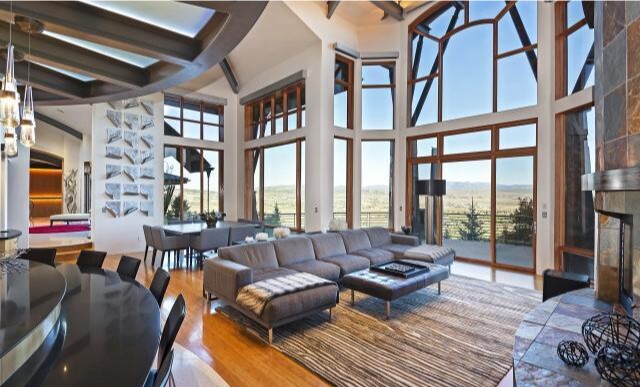 Built in 2006, the tri-level home holds five bedrooms, eight bathrooms, an expansive atrium, a movie theater, wet bar and golf course simulator.